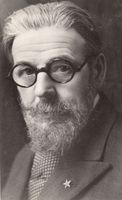 Portrait photo of Achilles De Maertelaere. He wears a star, symbol of the Esperanto movement